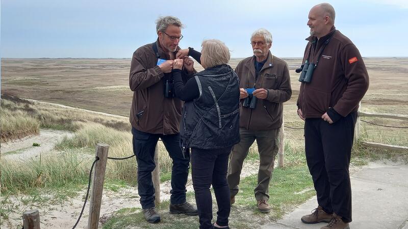 Dutch volunteers receive anniversary badges. Staatsbosbeheer Terschelling.